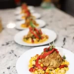 a row of plates of food created by a private chef in virginia beach